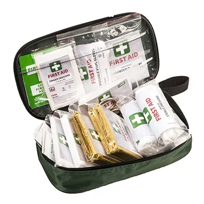 FA23 First Aid Bag Open green first aid bag FA23 with bandages and dressings