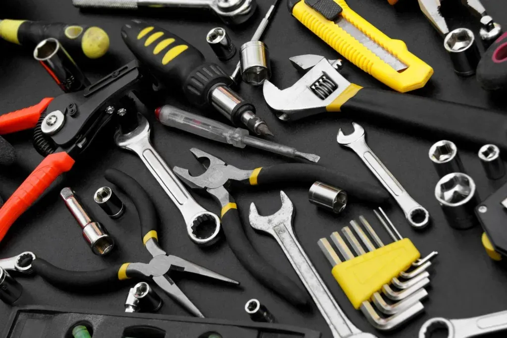 Assorted hand tools including wrenches, pliers, and screwdrivers
